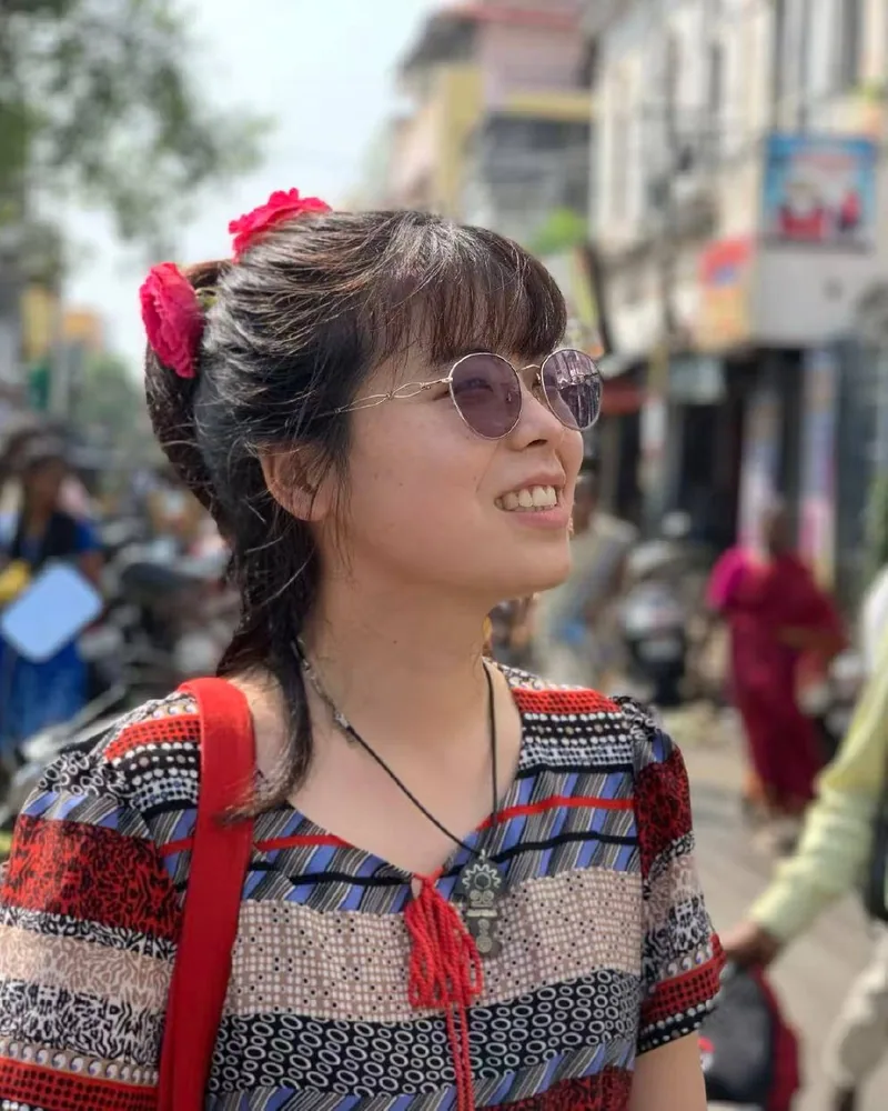 Portrait of Xueqi on a lively city street